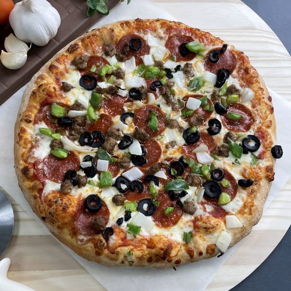 Big T's Pizza with pepperoni, sausage, green peppers, onions, and black olives.